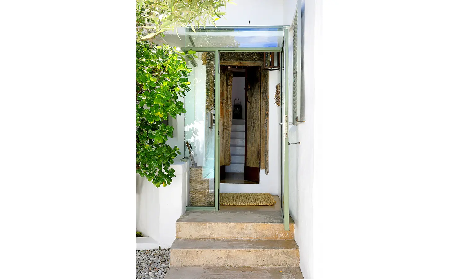 Perfect Hideaways: An inviting entryway featuring glass doors, steps leading inside, and lush greenery creating a welcoming atmosphere. Farniente, Kommetjie.