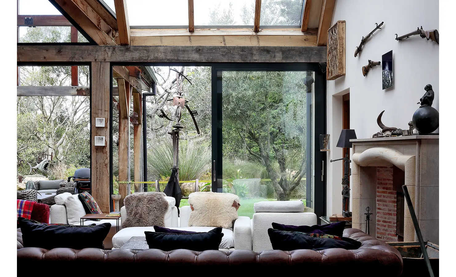 Perfect Hideaways. A stylish living room showcasing a fireplace and plush couches, perfect for relaxation and social gatherings. Gaia, Constantia.