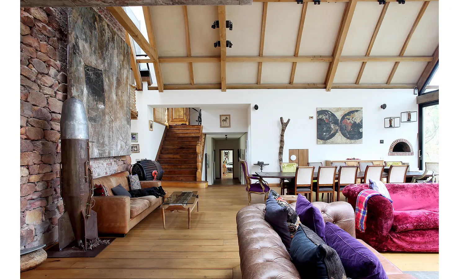 Perfect Hideaways. A cozy living room featuring a couch, table, chair, staircase, and a wall, creating a welcoming atmosphere. Gaia, Constantia.