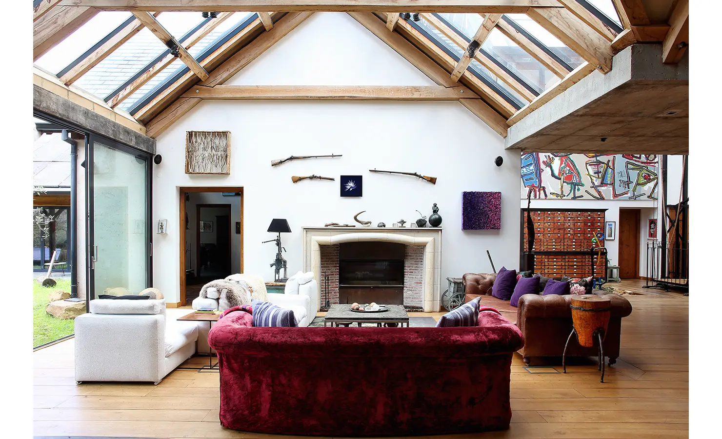 Perfect Hideaways. A cozy living room featuring a warm fireplace, inviting seating, and soft lighting for a comfortable atmosphere. Gaia, Constantia.