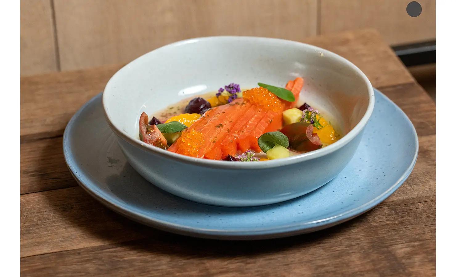 Perfect Hideaways: A delicate bowl of cured salmon with roe and edible flowers is beautifully plated for a refined culinary experience. AtholPlace Hotel & Villa, Atholl.