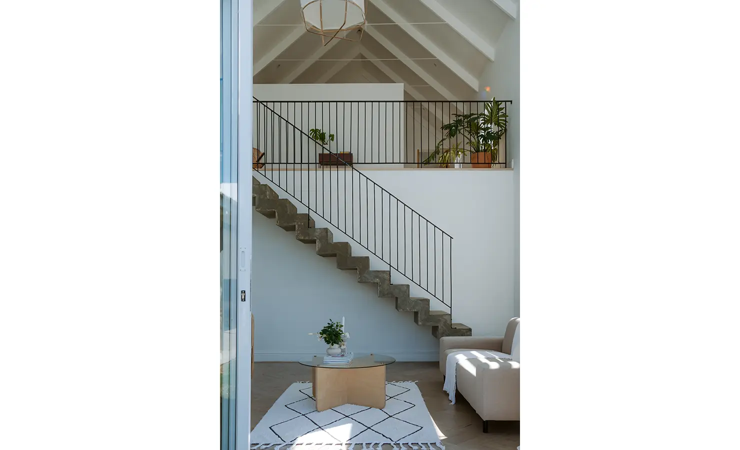 Perfect Hideaways: Loft-style sitting area with raw concrete staircase, minimalist décor, and potted greenery, Thuúla Haven, Hemel-en-Aarde.
