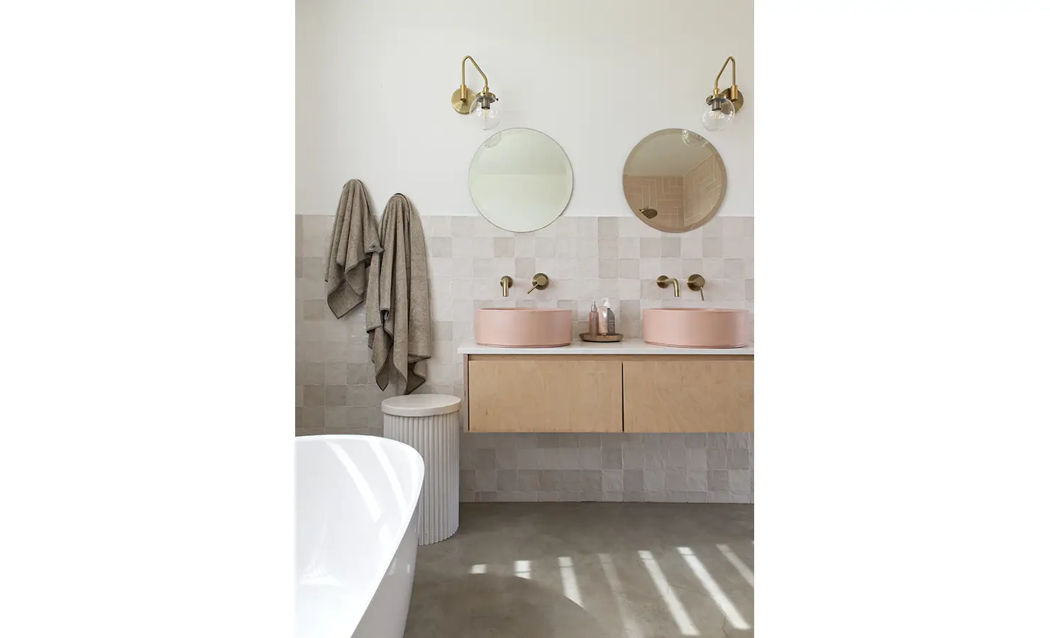 Perfect Hideaways: Bathroom with blush pink basins, twin mirrors, and warm brass fittings beside a freestanding tub, Thuúla Haven, Hemel-en-Aarde.