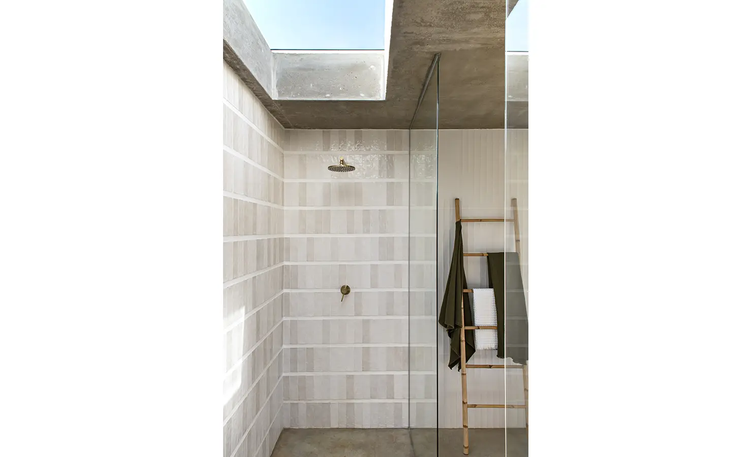 Perfect Hideaways: Walk-in shower with natural light streaming through a skylight, featuring textured tile walls and minimalist fixtures, Thuúla Haven, Hemel-en-Aarde.