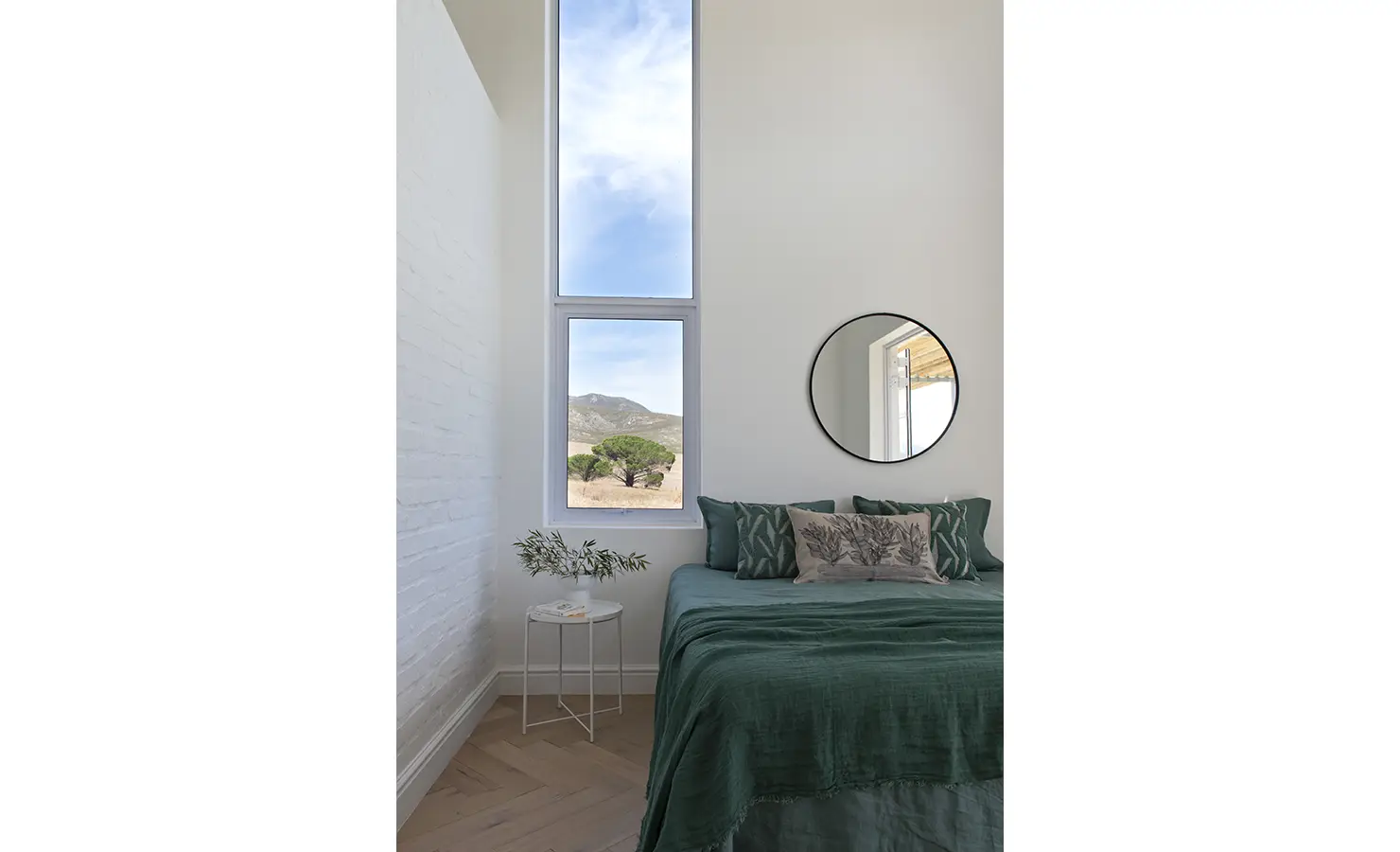 Perfect Hideaways: Cosy bedroom with deep green bedding, botanical-themed pillows, and mountain views through tall windows, Thuúla Haven, Hemel-en-Aarde.