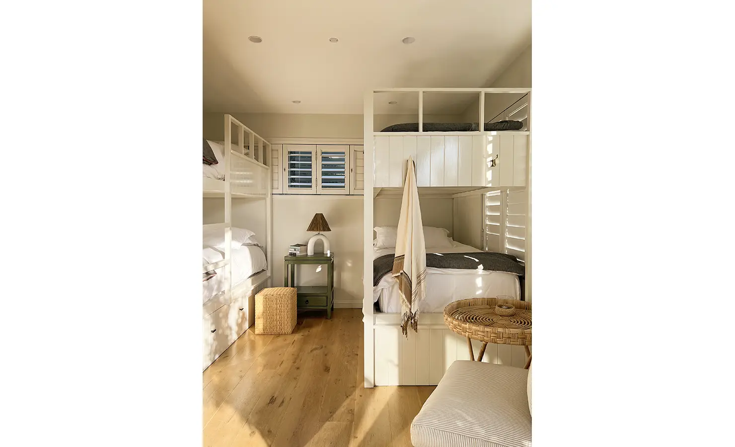 Perfect Hideaways: A charming bunk room with built-in beds, neutral tones, and warm wooden floors, perfect for relaxed coastal living. Sunset Cove, Kommetjie.