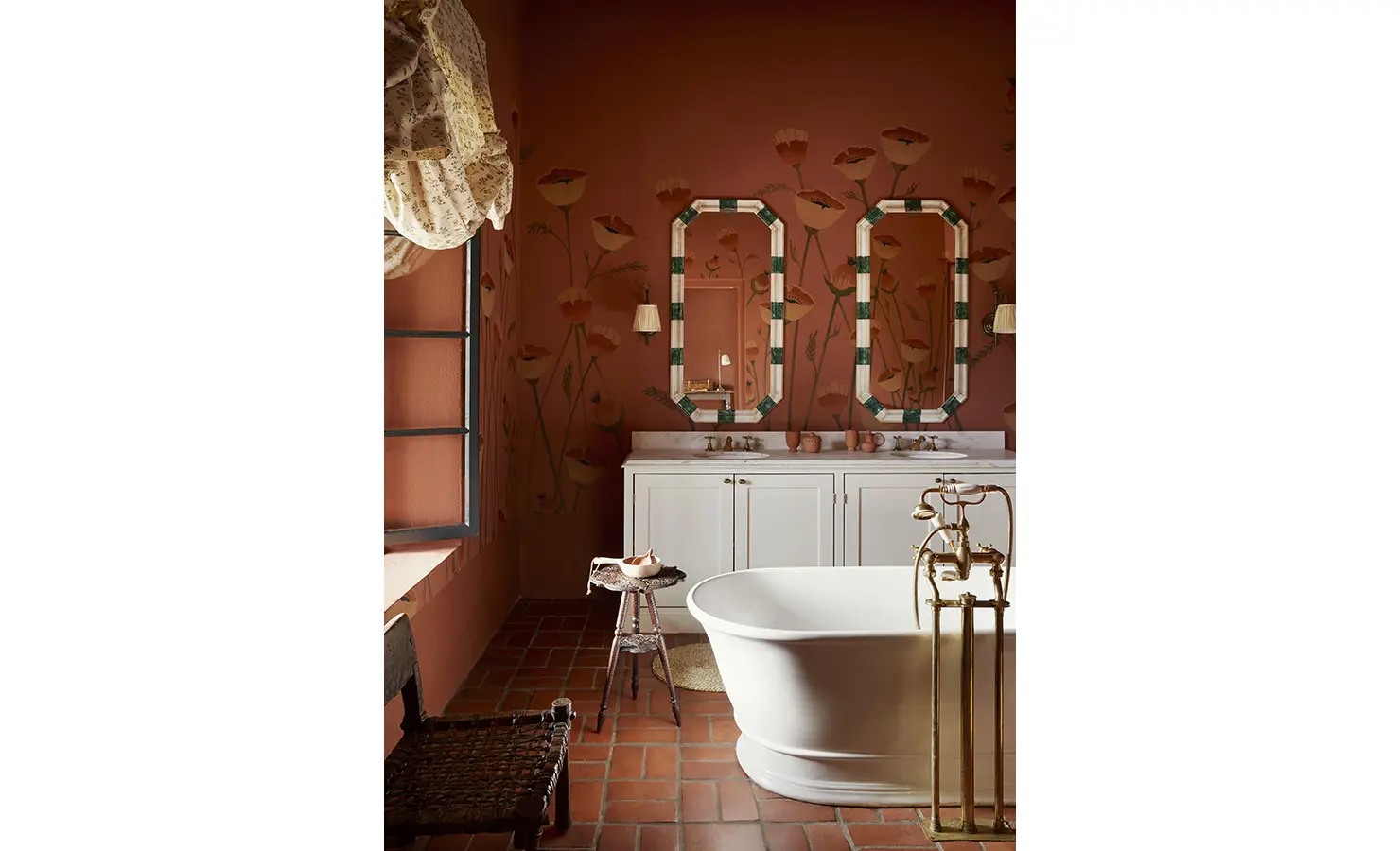 Perfect Hideaways: A sophisticated bathroom with floral wall art, a freestanding bathtub, and twin mirrors over a white vanity. Sterrekopje, Franschhoek.