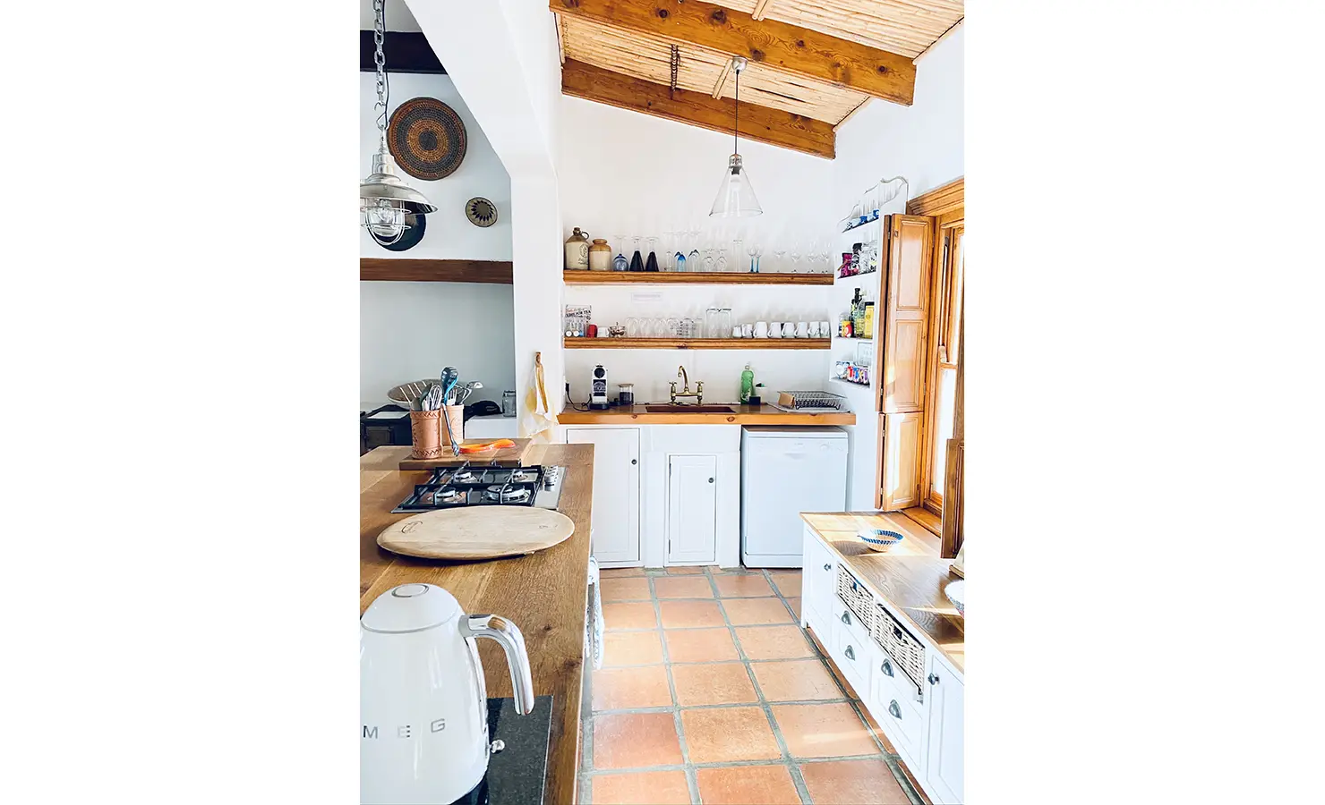 Perfect Hideaways: A bright and airy kitchen with a farmhouse aesthetic, featuring natural light, terracotta tiles, and wooden accents for a homely feel. 13 On Grewe, McGregor.