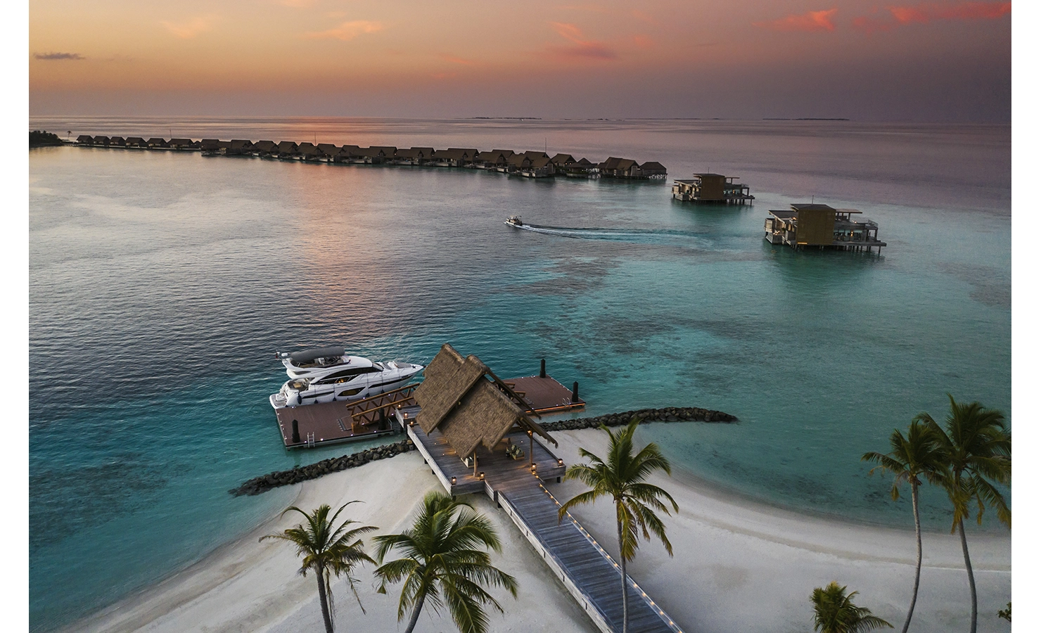 Perfect Hideaways, Itaafushi Maldives, Luxury accommodation aerial view of beach and ocean during sunset
