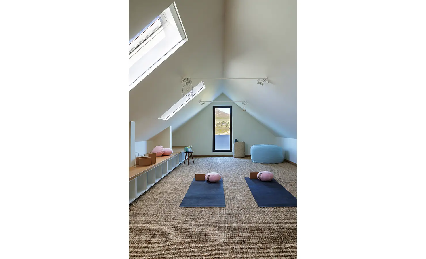 Perfect Hideaways: Peaceful yoga loft with skylights, floor mats, and views of the valley through a tall window. Stonehaven House, Hemel-en-Aarde.