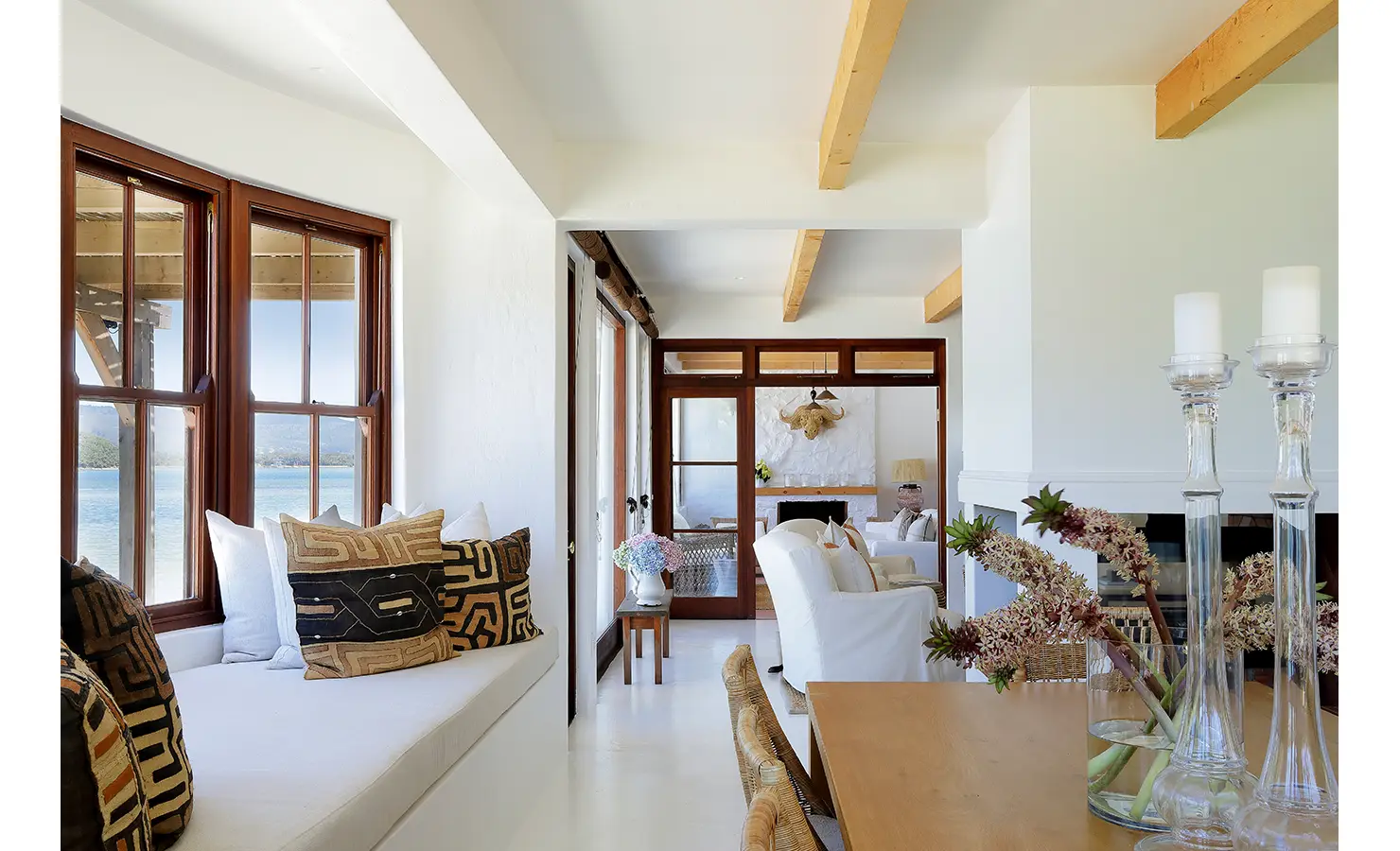 Perfect Hideaways: Window seat with patterned cushions beside the dining area, framing serene views of the lagoon, Knysna, Tides Reach