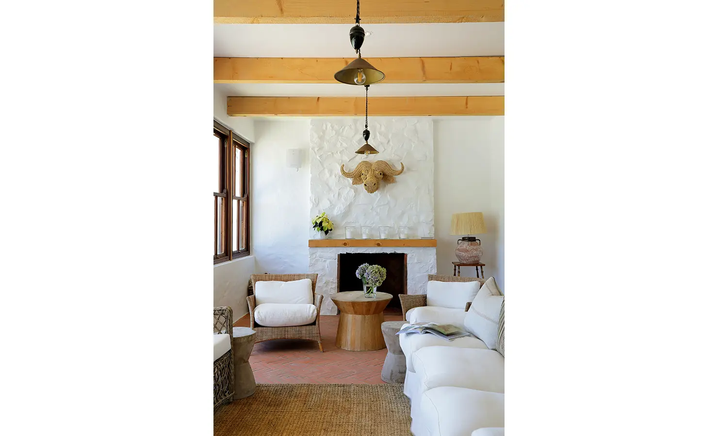 Perfect Hideaways: Intimate sitting room with textured white fireplace, wicker armchairs and soft neutral sofas, Knysna, Tides Reach
