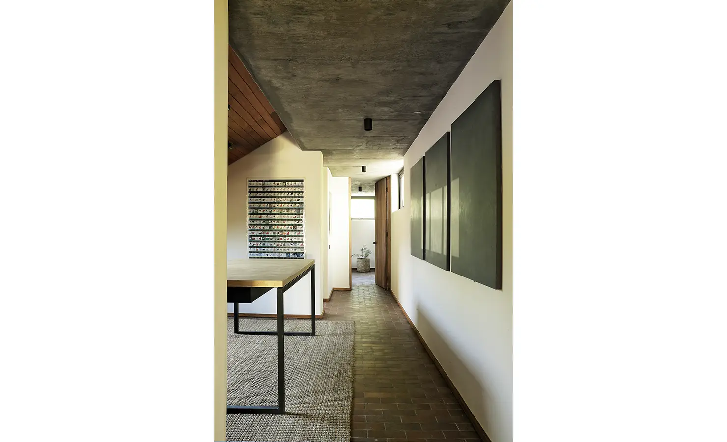 Perfect Hideaways: long corridor with concrete soffit, contemporary artworks and natural light leading to the living areas, Franschhoek, The Garden House