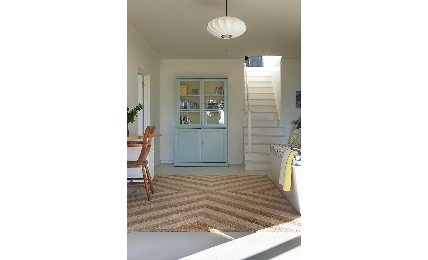 Perfect Hideaways: Bright lower level with chevron rug, mint cupboard and a built-in bench by the stairs — simple beach-house charm, Amongst The Trees, Scarborough.