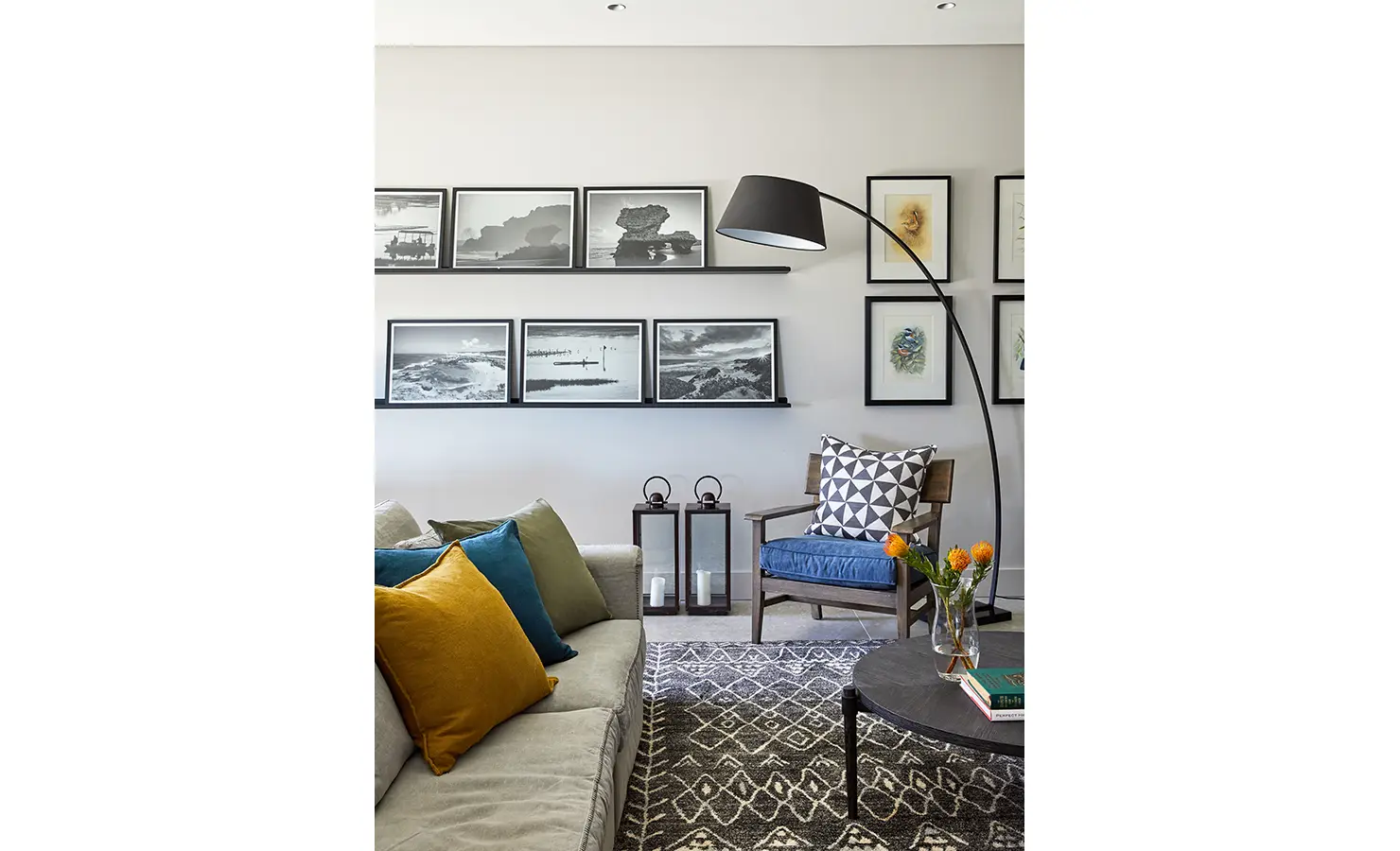 Perfect Hideaways: A cosy living space with a contemporary sofa, bold scatter cushions, modern art-lined walls, and graphic monochrome décor. St Austel, Kenton-on-Sea