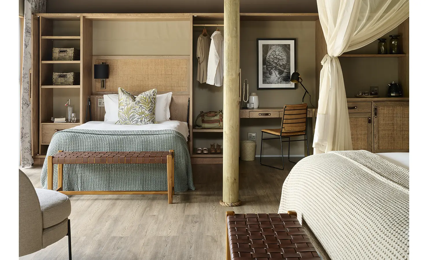 Perfect Hideaways: Spacious suite showing a second bed area with open wardrobes, desk nook and woven textures, Rapid's View Villa, Zambezi National Park