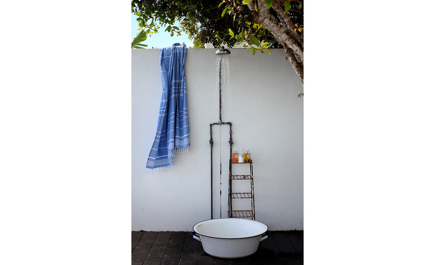 Perfect Hideaways: rustic outdoor shower with enamel basin, vintage pipework and a blue peshtemal hanging on the wall, Langebaan, Lagoon Lookout.