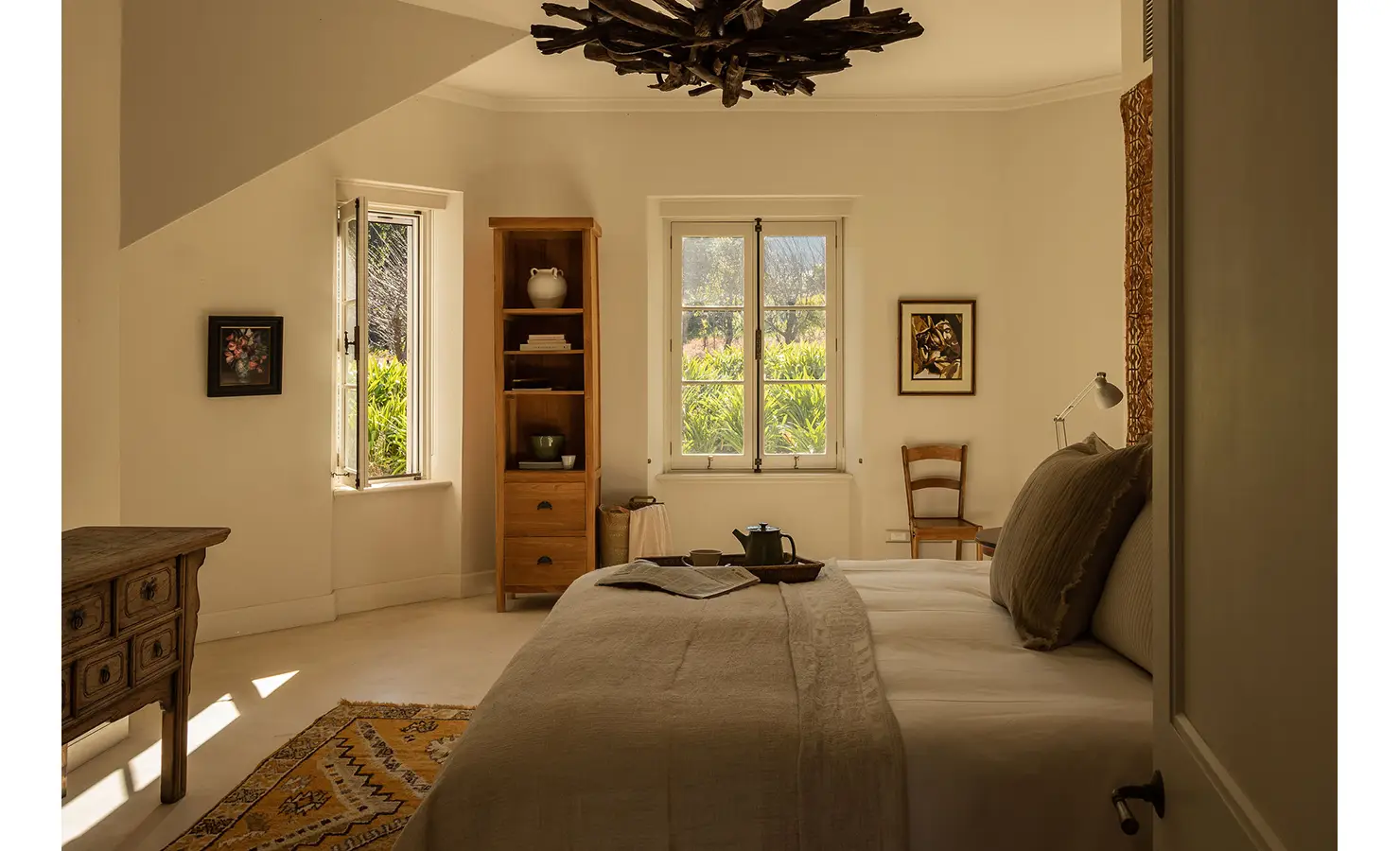Perfect Hideaways peaceful bedroom with natural light, simple wooden furniture, and earthy décor creating a calm retreat, Franschhoek, Varuna.