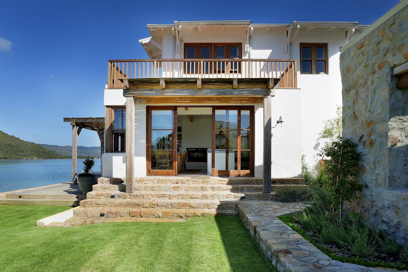 Perfect Hideaways: Waterfront home with stone steps, timber-framed doors and a broad balcony opening to the lagoon, Knysna, Tides Reach