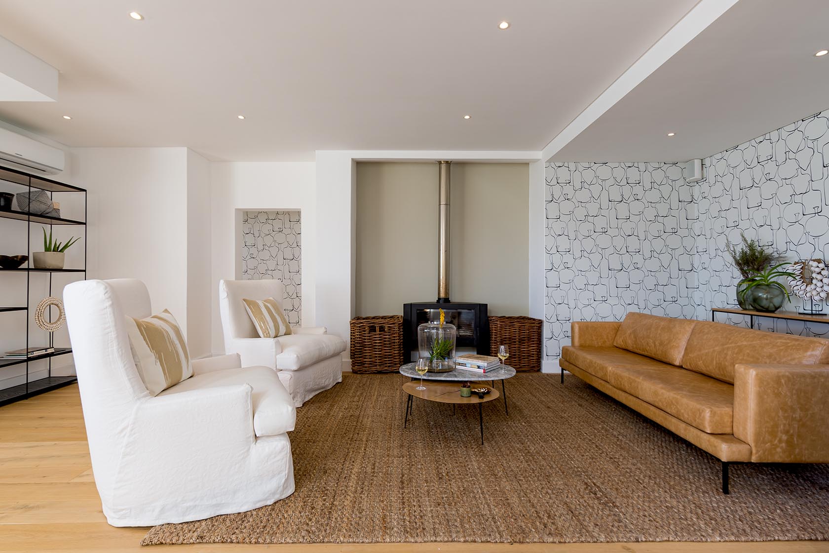 Perfect Hideaways - Contemporary sitting room with fireplace, woven rug and neutral furnishings creating a warm coastal retreat Noordhoek Seashore_Noordhoek_Southern Peninsula_Cape Town_Western Cape_South Africa