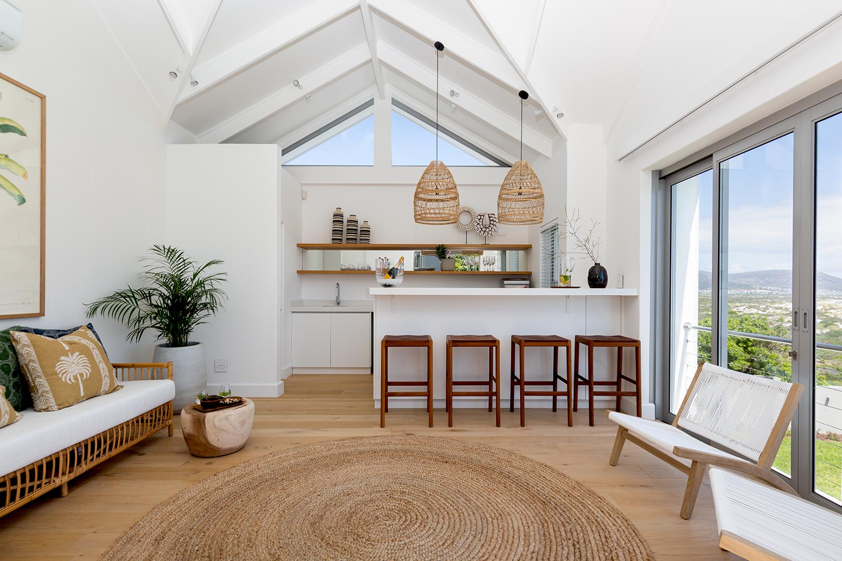 Perfect Hideaways - Bright coastal bar and lounge area with vaulted ceilings, woven pendant lights and mountain views through large sliding doors Noordhoek Seashore_Noordhoek_Southern Peninsula_Cape Town_Western Cape_South Africa