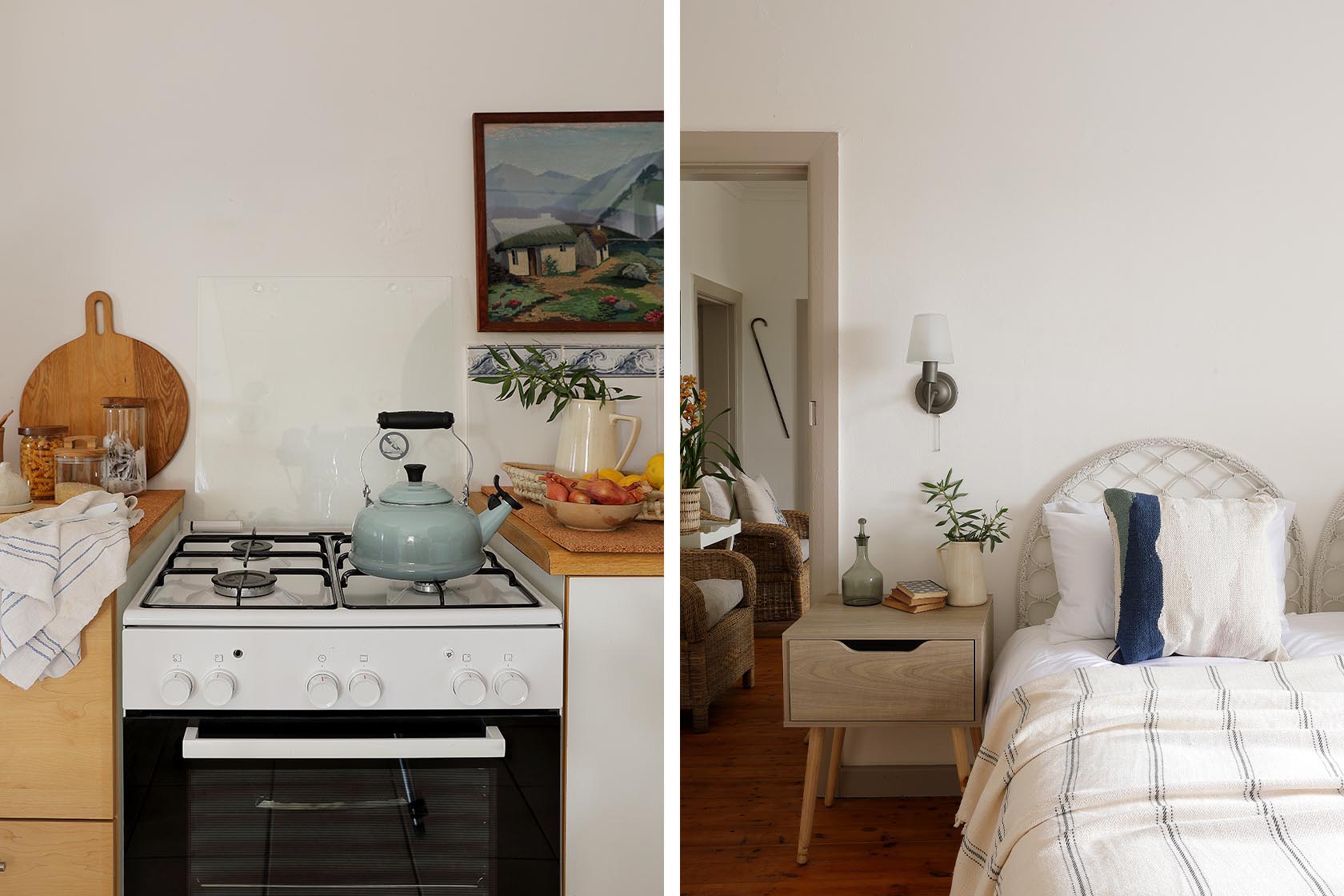 Perfect Hideaways – A simple kitchen scene showing a clean white stove with a pastel kettle, wooden cutting boards, glass jars, and a still-life arrangement of fruit and pottery beneath a framed landscape artwork. Berit’s Cottage, Churchhaven, South Africa.