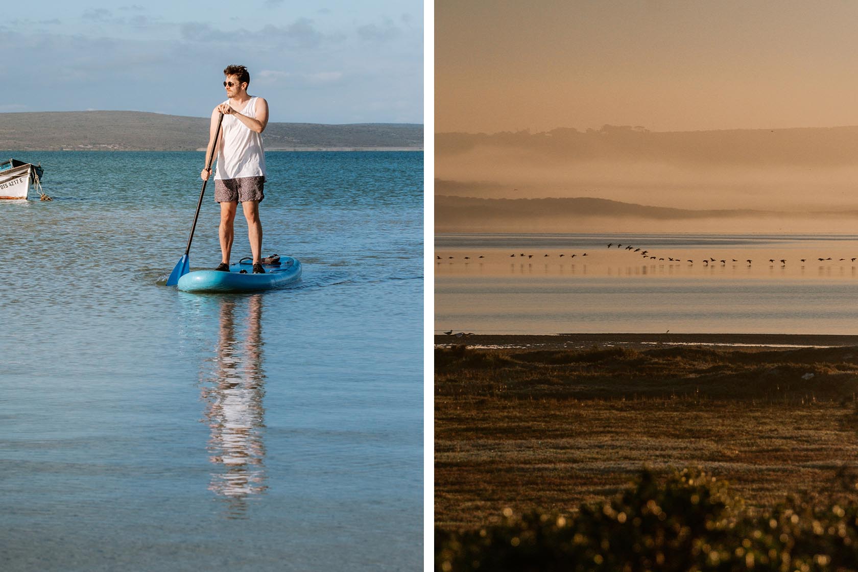 Perfect Hideaways- Man standing paddleboarding on calm lagoon waters with distant hills and a small boat nearby under clear blue skies, Yellowwood Cottage, Churchhaven, Western Cape, South Africa
