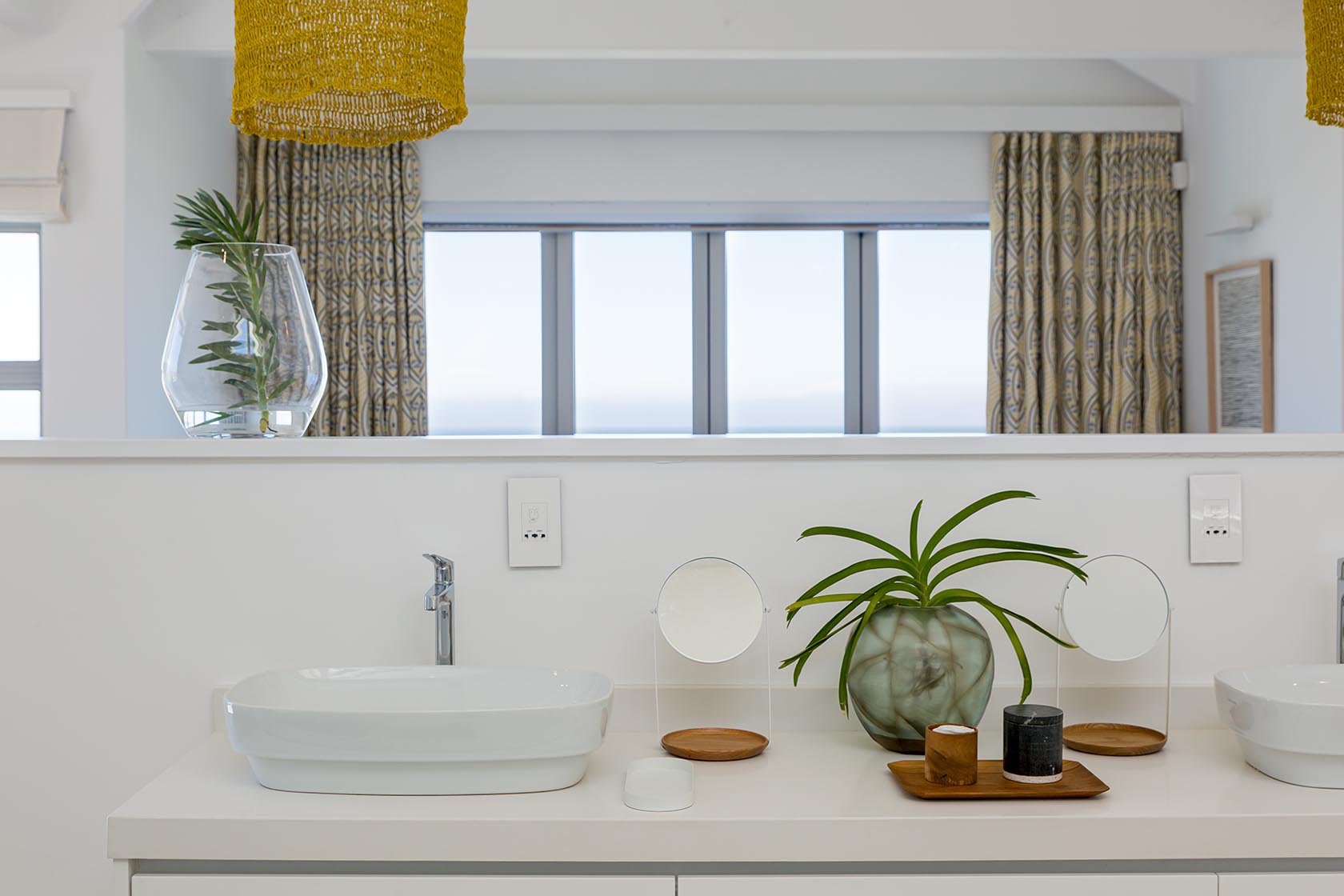 Perfect Hideaways - Minimalist en-suite bathroom vanity with modern basin, natural wood accents and soft coastal décor beneath woven pendant lighting Noordhoek Seashore_Noordhoek_Southern Peninsula_Cape Town_Western Cape_South Africa