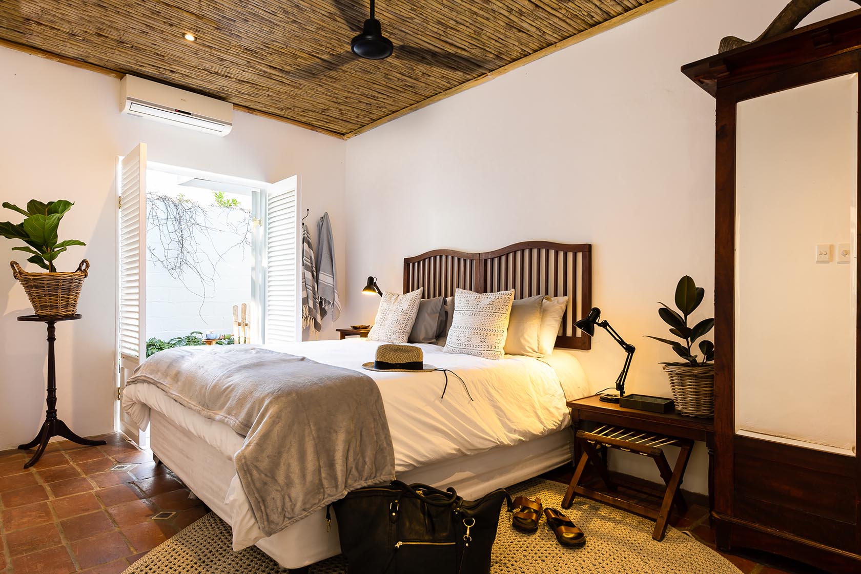 Perfect Hideaways-Stylish bedroom with a wooden headboard, layered neutral bedding, bedside lamps, and doors opening to the garden, blending indoor and outdoor living Valley Cottage, Riebeek Casteel, Western Cape, South Africa