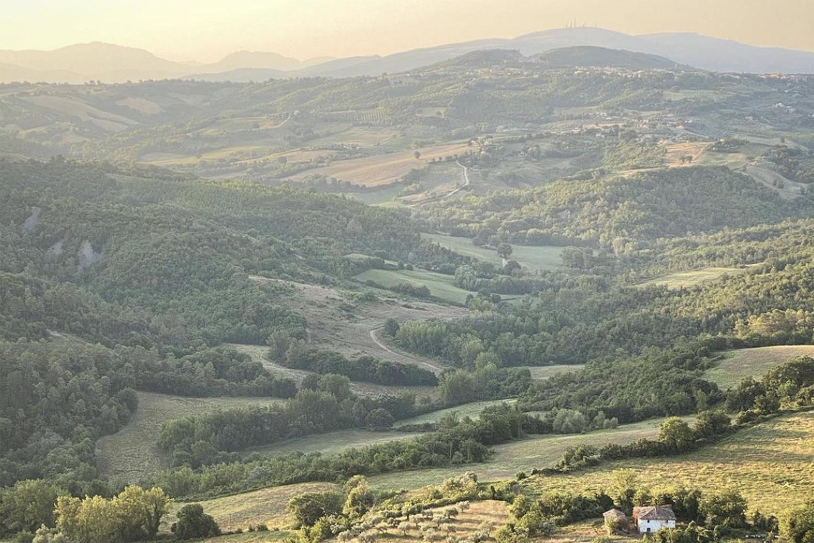 Perfect Hideaways panoramic view of Umbria’s rolling hills and countryside at sunset, Umbria Cottage, Collazzone