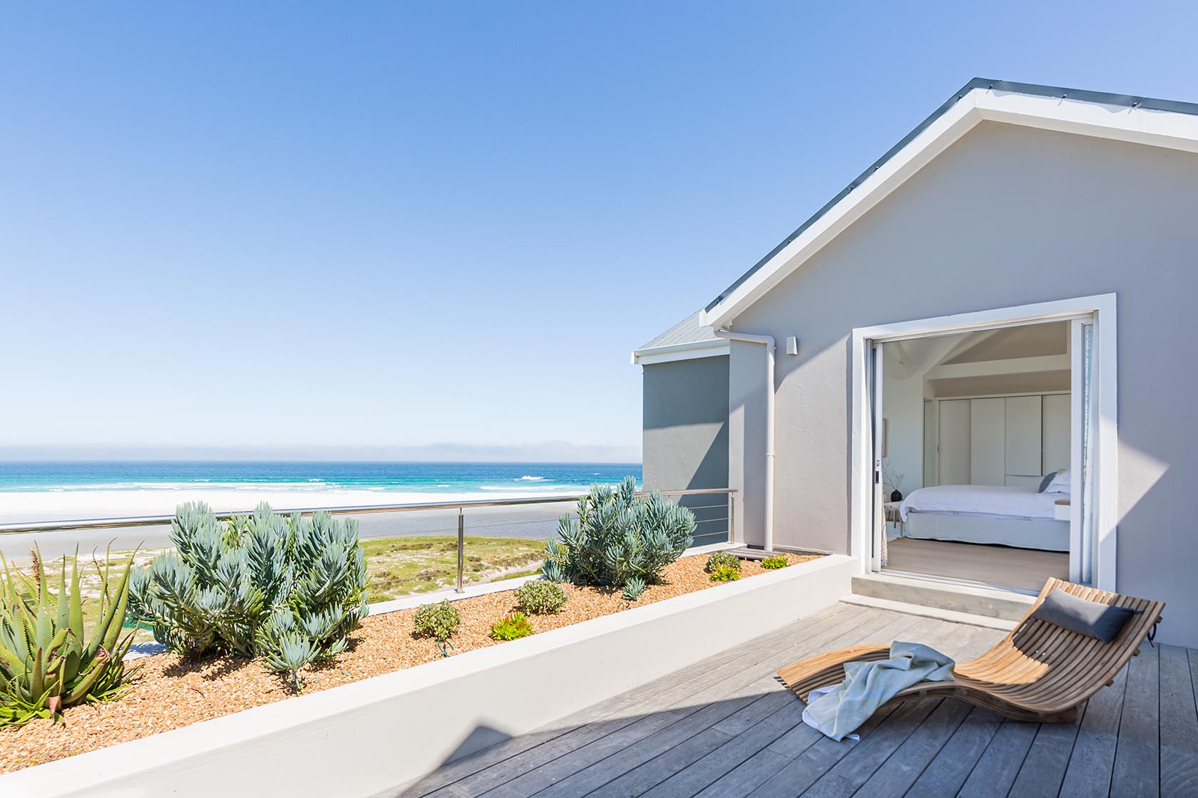 Perfect Hideaways - Private bedroom deck with sculptural sun lounger, landscaped planters and uninterrupted views of Noordhoek beach and the Atlantic Ocean Noordhoek Seashore_Noordhoek_Southern Peninsula_Cape Town_Western Cape_South Africa