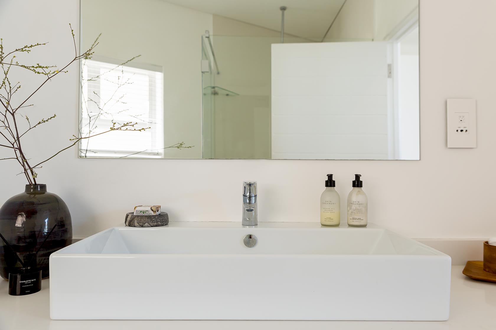 Perfect Hideaways - Clean-lined bathroom vanity with rectangular basin, wall mirror, neutral toiletries and understated coastal styling Noordhoek Seashore_Noordhoek_Southern Peninsula_Cape Town_Western Cape_South Africa