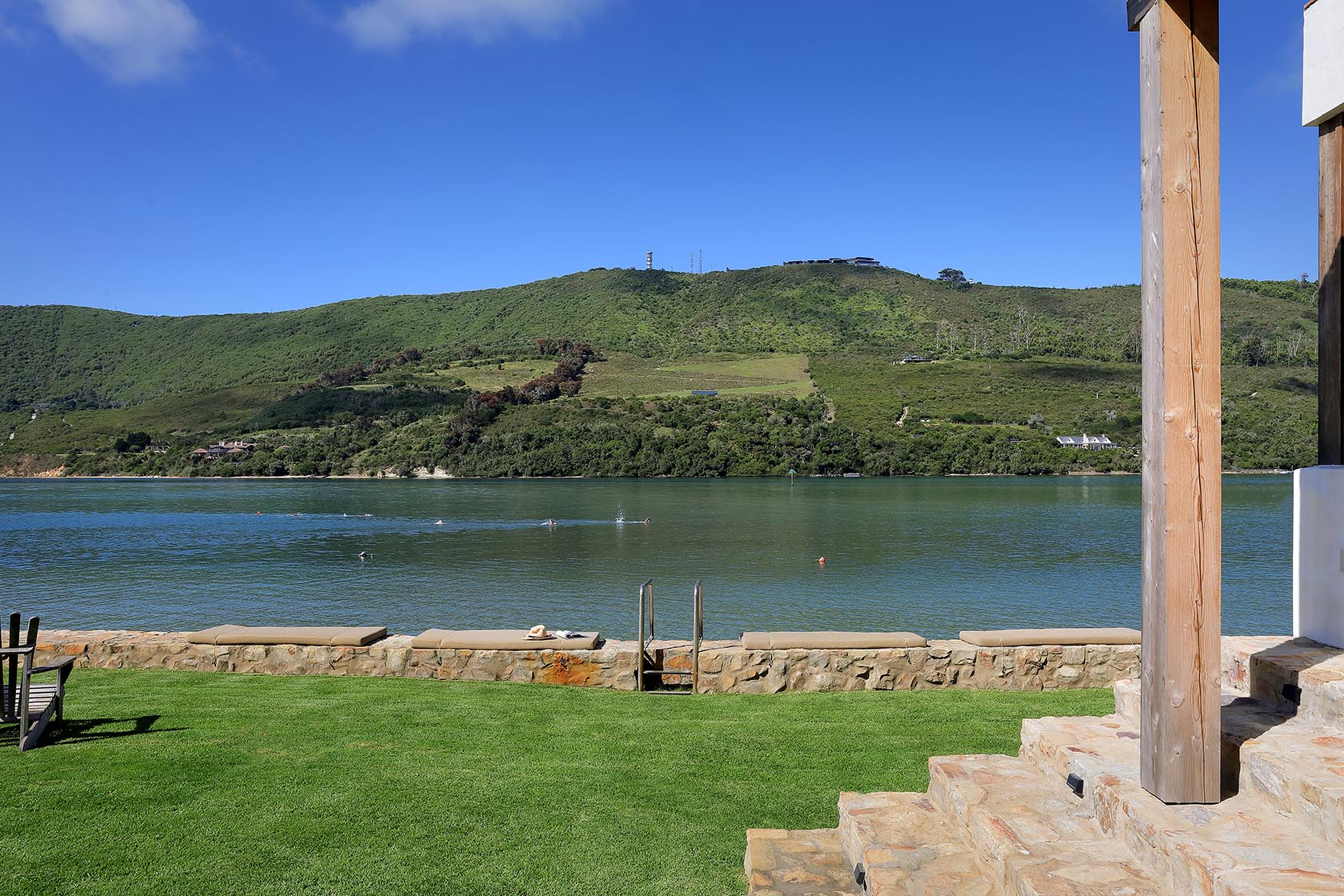 Perfect Hideaways: Playful portrait series above a white loveseat in a cosy snug, Knysna, Tides Reach