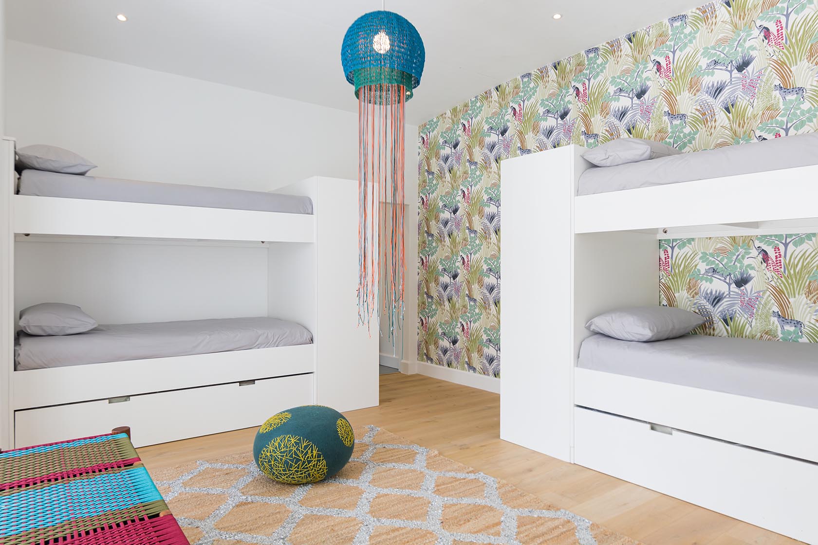 Perfect Hideaways - Bright bunk bedroom with custom white bunks, playful patterned wallpaper, woven pendant light and warm wooden floors Noordhoek Seashore_Noordhoek_Southern Peninsula_Cape Town_Western Cape_South Africa