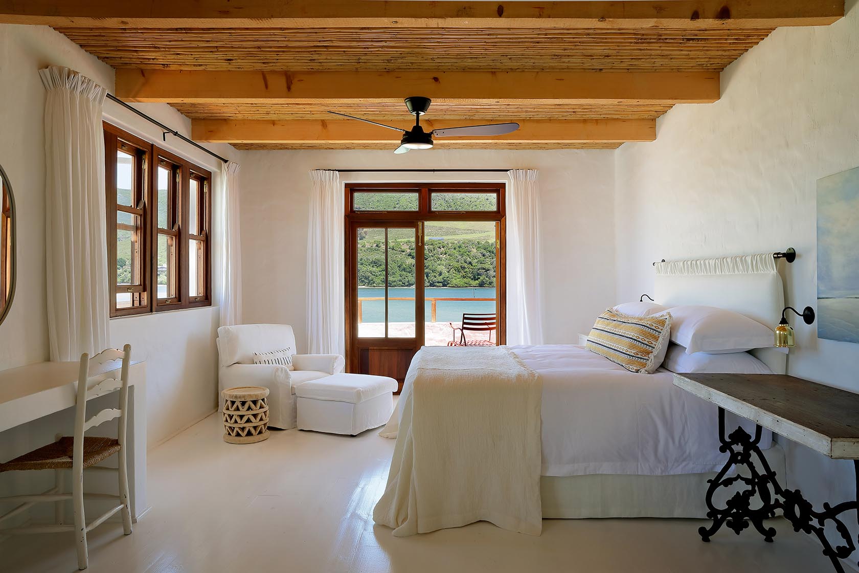 Perfect Hideaways: Serene main bedroom with ceiling fan, dressing table and doors to a balcony above the lagoon, Knysna, Tides Reach