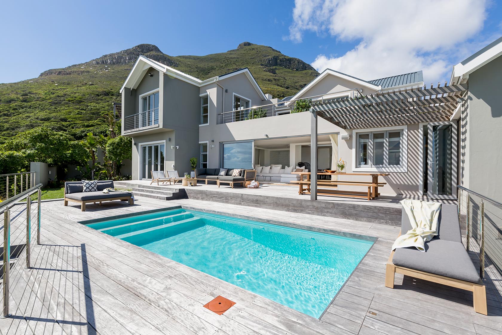 Perfect Hideaways - Stylish outdoor entertaining area with swimming pool, pergola-covered seating and modern coastal home set beneath the mountain slopes Noordhoek Seashore_Noordhoek_Southern Peninsula_Cape Town_Western Cape_South Africa