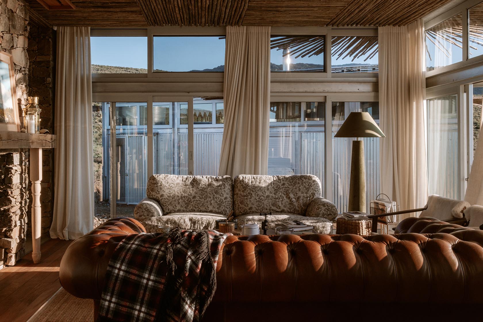 Perfect Hideaways elegant living room with warm interiors and expansive countryside views, Jackals Rest, Montagu.