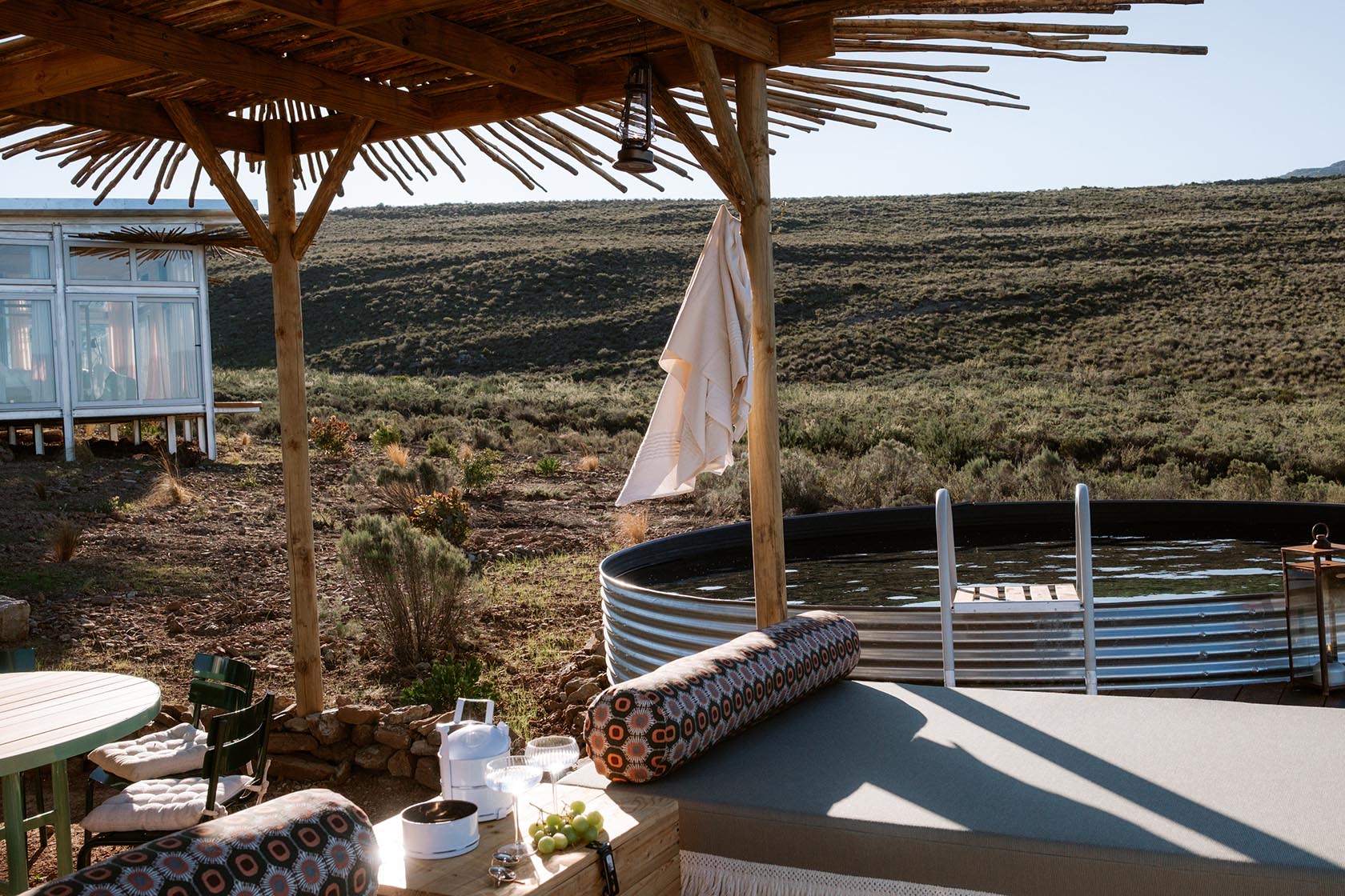 Perfect Hideaways shaded relaxation deck with daybed beside the plunge pool and mountain views, Jackals Rest, Montagu.